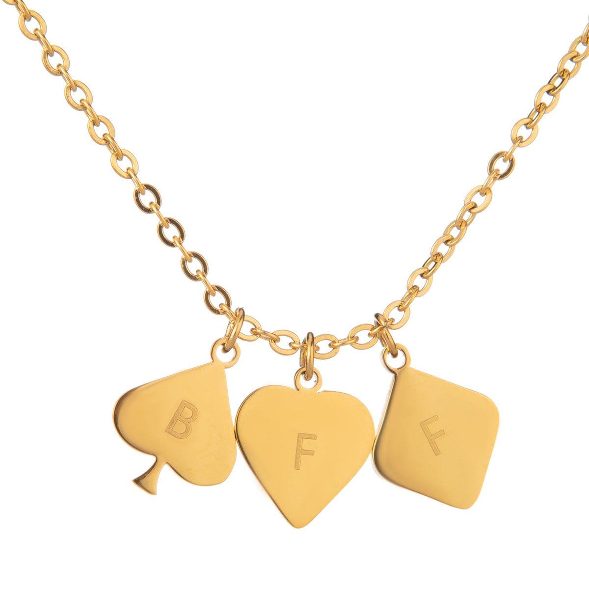 A gold-plated necklace with three playing card initial pendants attached to it, displayed against a white background.
