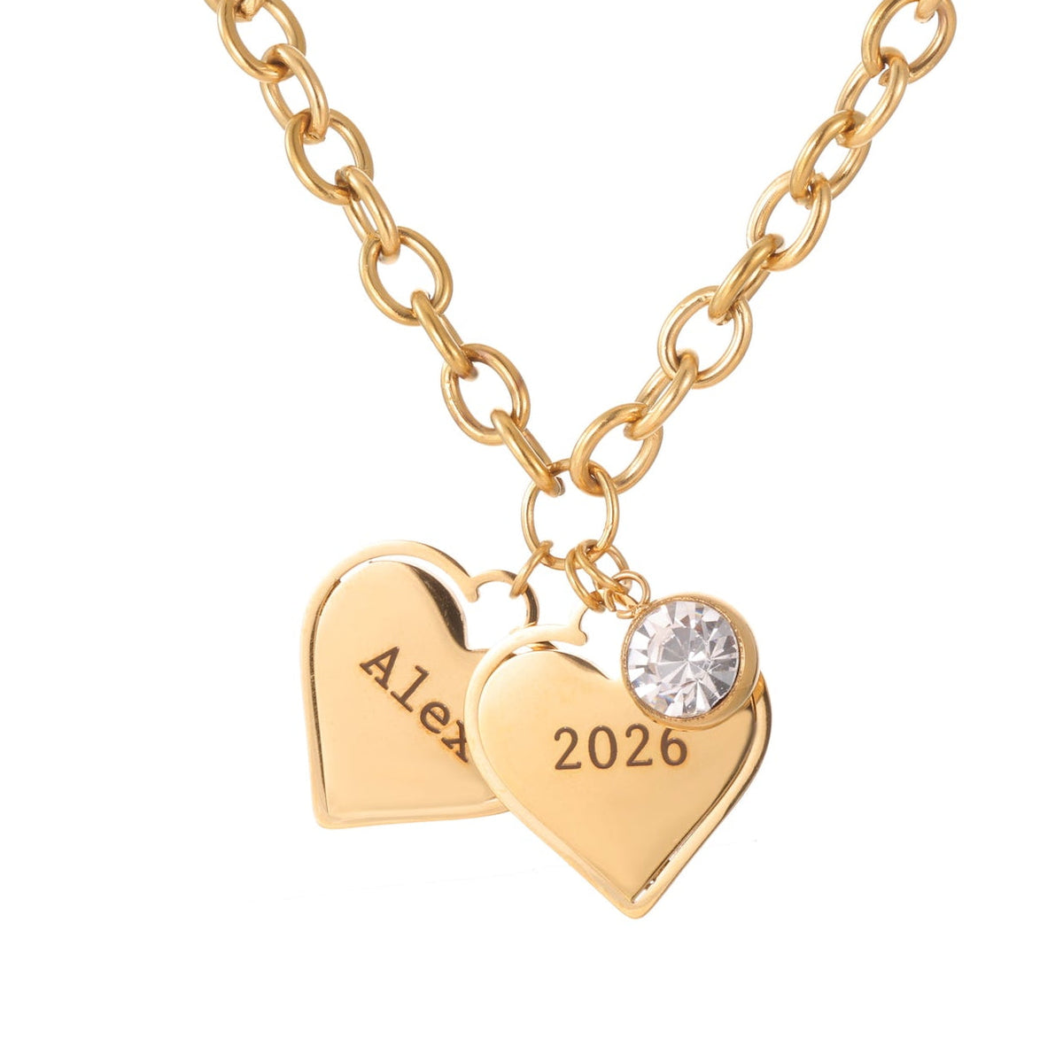 Gold necklace with heart-shaped pendants engraved with 'Alex' and '2026', featuring a clear gemstone on a white background.