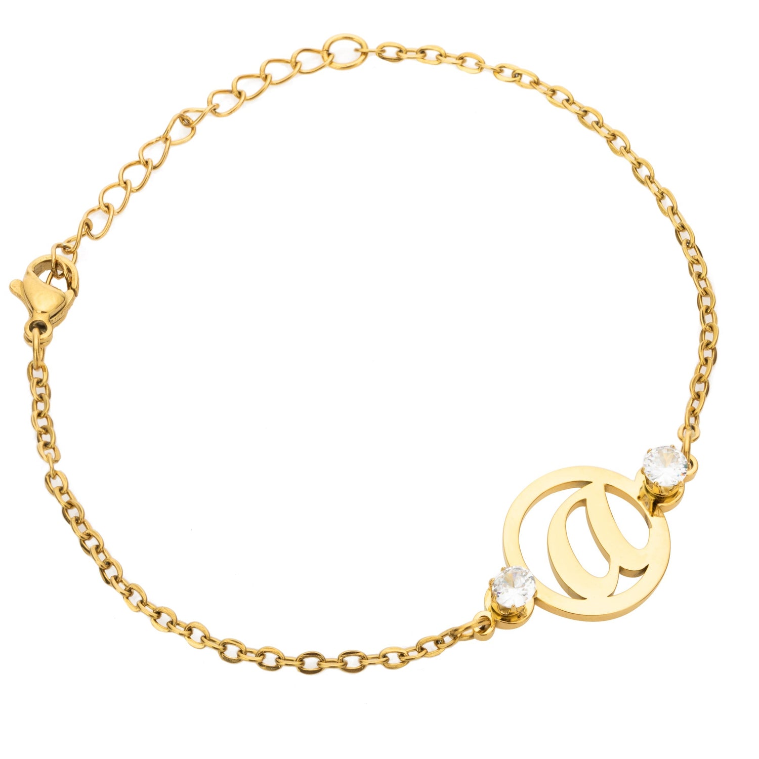 A gold-colored bracelet featuring a single initial letter surrounded by two small clear stones, displayed on a white background.