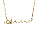A gold-plated necklace with a custom name in flowing signature script.